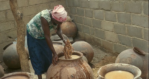 Picture of Woman working with fermentation of beer in Burkina Faso